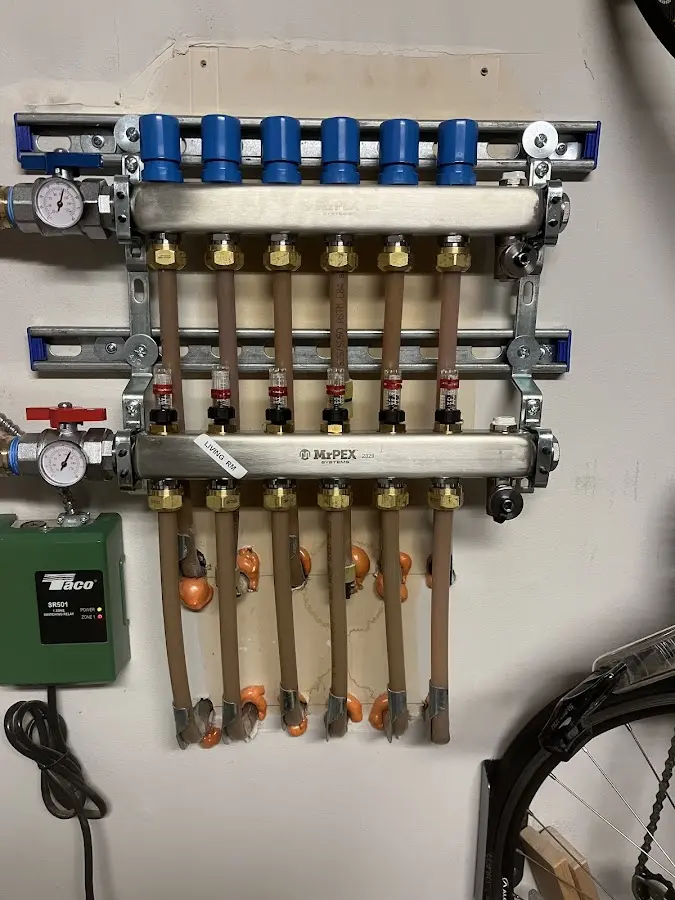 Plumber performing Water Heater Repair at a residential property in North Logan